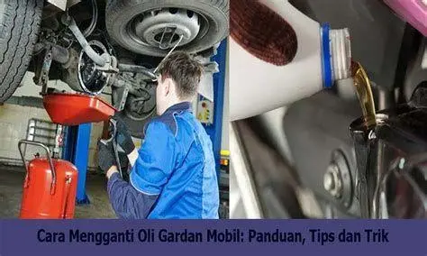 Proses Ganti Oli Gardan Mekanik sedang mengisi oli gardan menggunakan pompa khusus